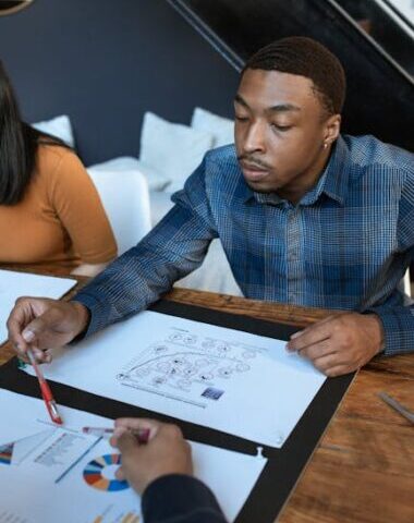 Business team engaged in analyzing graphs during a professional meeting at the office.